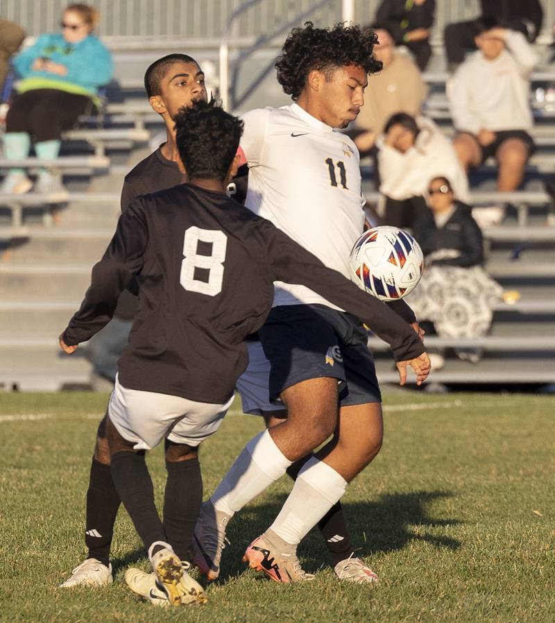 Sterling’s Anthony Rosas handles the ball against a pair of Dunlap defenders Wednesday, Oct. 23, 2024, during the class 2A soccer regional semifinal in Geneseo.