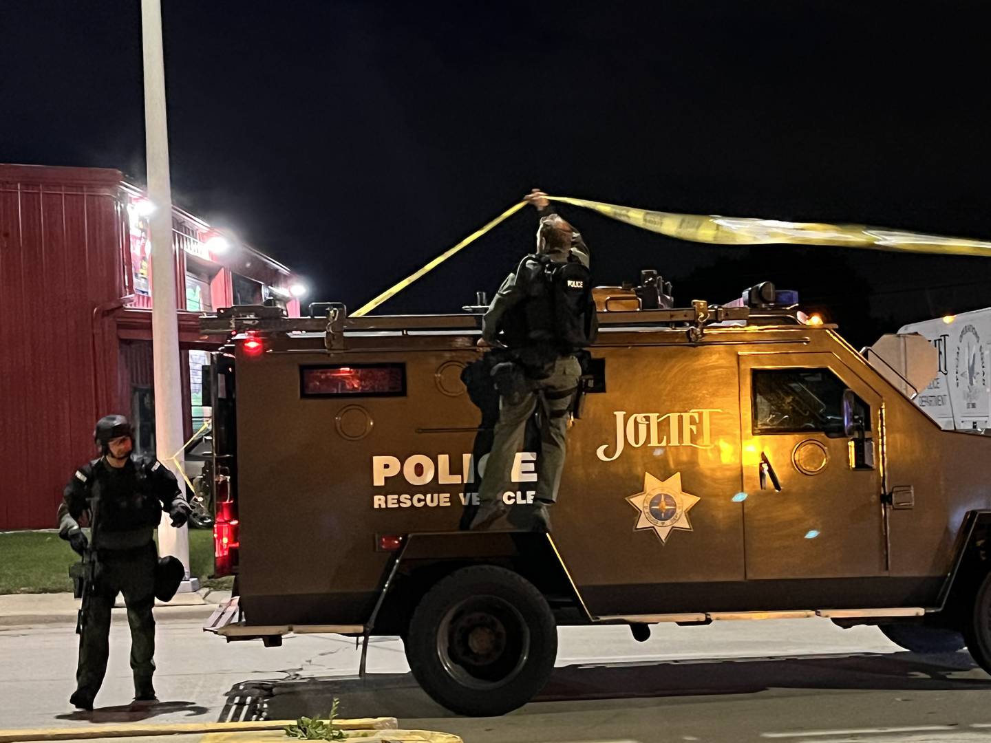 A Joliet police rescue vehicle moves into the scene of an incident at the 200 block of Center Street in Joliet at 10:48 p.m. on Thursday, Oct. 6, 2022.