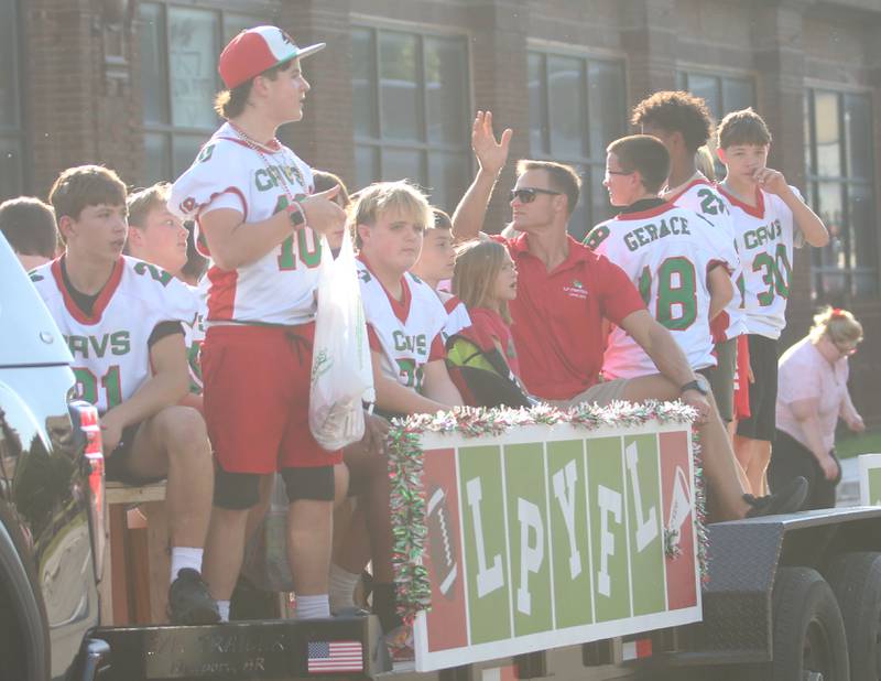 The L-P Youth Football League team rides on a float during the L-P homecoming parade on Thursday, Oct. 2, 2025 downtown Peru.