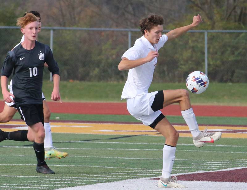 Timothy Christian's Carter Day (5) keeps the ball from going out of bounce as Wheaton Academy's Lucas Landstrom (10) defends during the Class 1A State soccer third place game on Saturday, Oct. 29, 2022 at EastSide Centre in Peoria.