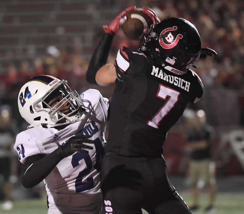 Barrington’s Matt Marusich makes a touchdown catch against Warren’s John McGinn at Barrington High School Friday, August 25, 2023.