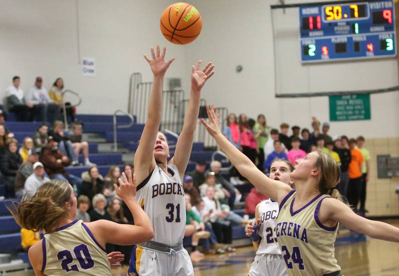 Somonauk/Leland's Allayna Wold lets go of a jump shot over Serena's Rayelle Brennan and Anna Hjerpe on Monday, Feb. 10, 2025 at Somonauk High School.
