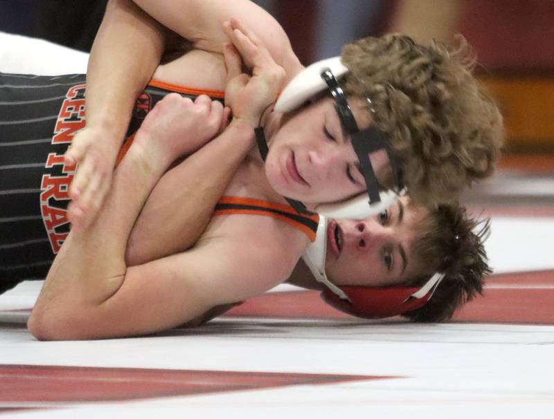 Huntley’s Matt Keaty, back, battles Crystal Lake Central’s Richie Butler at 144 pounds in varsity wrestling on Friday, Dec. 13, 2024 at Huntley High School in Huntley.