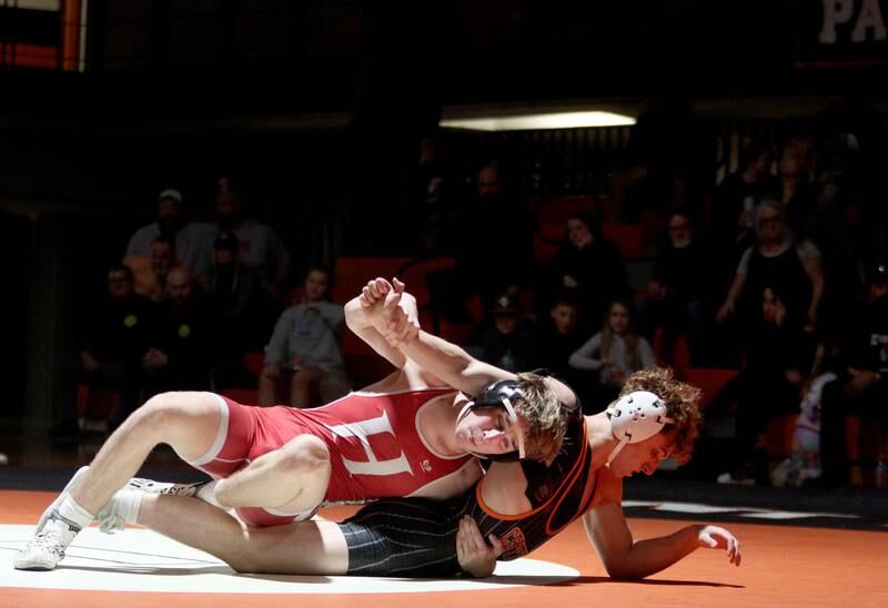 Crystal Lake Central’s Alessio Pezzella battles Huntley’s Shane McGuine in a 150-pound bout in varsity wrestling at Crystal Lake Friday. Pezzella won the match.