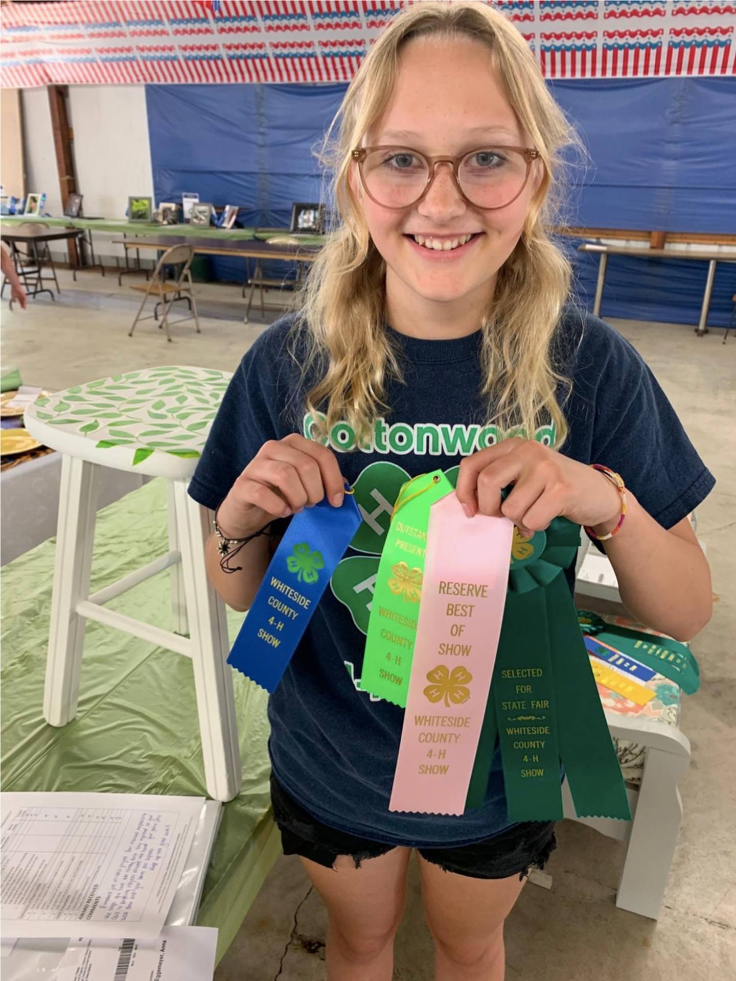 Anna Eggemeyer of the Cottonwood Club in Morrison poses with her 4-H ribbons for her Interior Design project at the Whiteside County 4-H Fair.