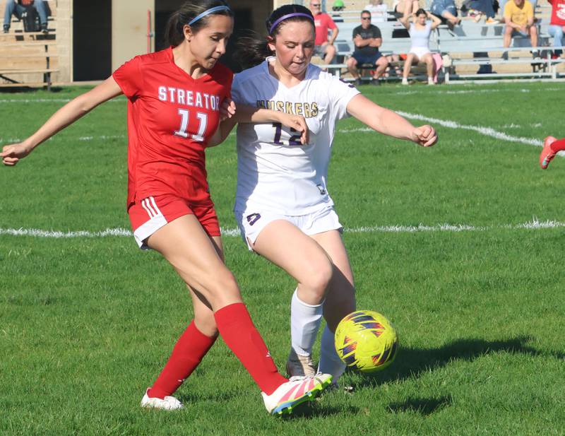 Streator's Briana Chavez kicks the ball ahead of Serena/Newark/Earlville's Alexa McNally on Thursday, April 16, 2026 at the James Street Recreational Complex in Streator.