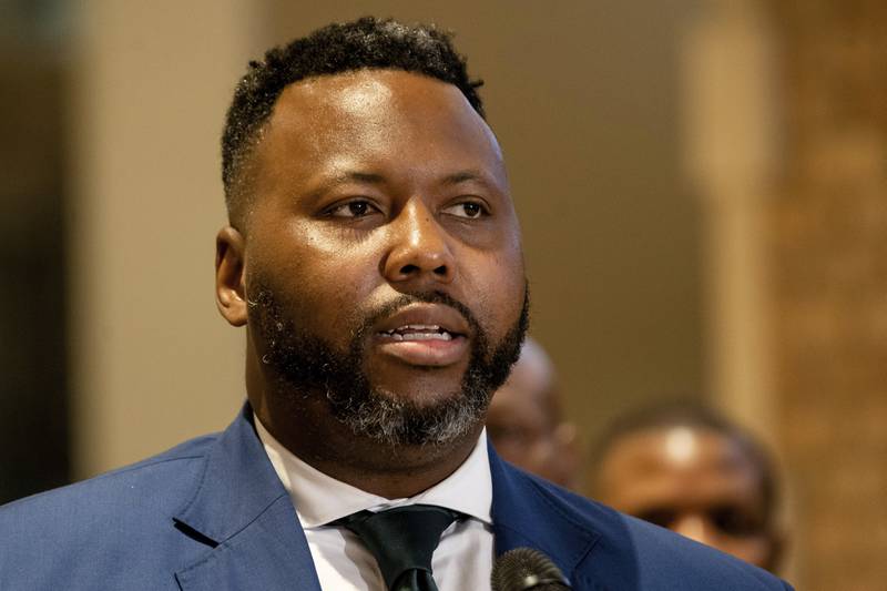 State Rep. and Chicago mayoral candidate Kam Buckner speaks during a press conference at the Water Tower Place in the Gold Coast neighborhood of Chicago, Friday morning, May 13, 2022, where Gov. J.B. Pritzker signed into law a bill that targets organized retail theft.