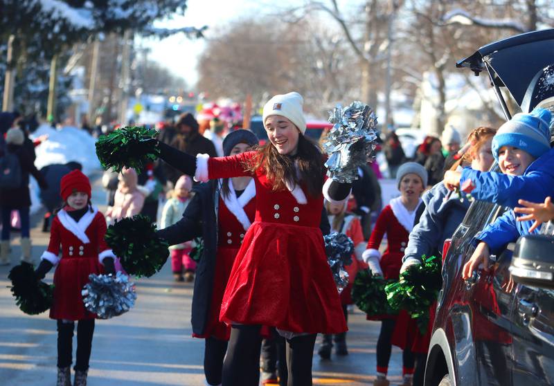 Members of the Inspiration Dance Studio march during the Merry Cary Christmas Parade in Cary on Sunday, Dec. 7, 2025 in Cary.