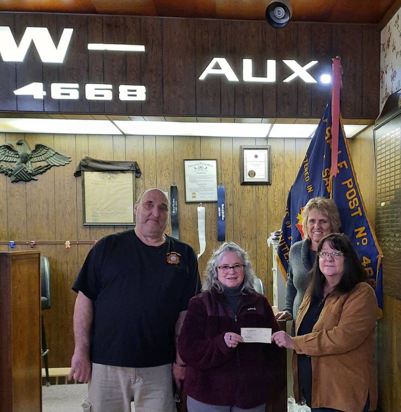 Kramer's Guns & Supplies in Spring Valley recently held two raffles for the La Salle VFW Auxiliary,  yielding $3,490 in proceeds to help veterans in the Illinois Valley. Pictured accepting the proceeds are (from left) auxiliary member Gerry Dempsey, auxiliary president Lisa Manijak, Teri Kramer of Kramer's Guns and auxiliary member Carla Margis.