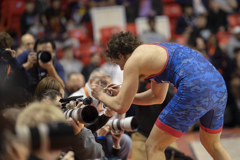 St. Viator’s Jaxon Penovich celebrates winning the 190 pound title Saturday, Feb. 21, 2026, at the IHSA wrestling finals in Champaign.