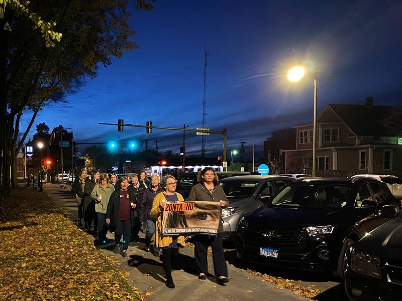 Members of the Zonta Clubs march along Lafayette Street on Washington Square Park's north side in an effort to raise awareness of domestic violence.