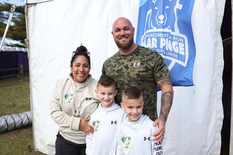 Will County Sheriffs deputies and husband and wife Victoria and Mike Sims stand with their 7-year-old twin boys Harris and Berkley at the annual Law Enforcement Torch Run Polar Plunge for the Special Olympics on Saturday, Mar. 9th in Braidwood.