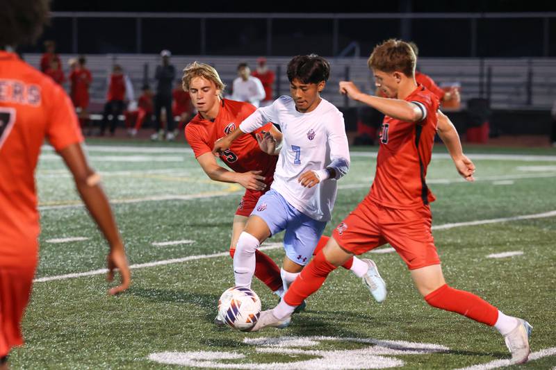 Kankakee's Alexis Cruz dribbles under pressure from Bradley-Bourbonnais' Bennett Dykstra, right, and Brayden Watters during the Boilermakers' 1-0 victory over Kankakee in the All-City matchup on Tuesday, Sept. 9, 2025.