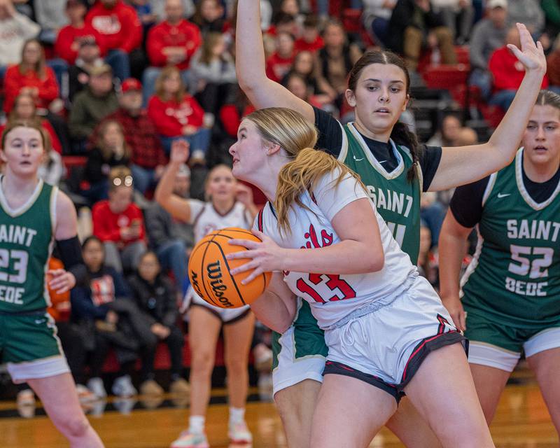 Hall's Caroline Morris (13) pushes into St. Bede’s Hannah Waszkowiak (44) before going up for a layup on Saturday, January 31, 2026 at Hall High School in Spring Valley.