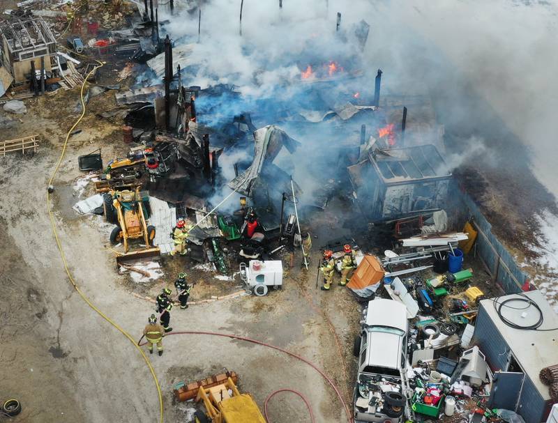 Firefighters extinguish flames from a structure fire in the 4000 block of East 16th Road on Thursday, Feb. 5, 2026 near Earlville. Fire departments from Serena, Mendota, Troy Grove and others were dispatched shortly after 12p.m. to the fire. The fire was upgraded to the second alarm through the Mutual Aid Box Alarm System (MABAS 25) shortly after.