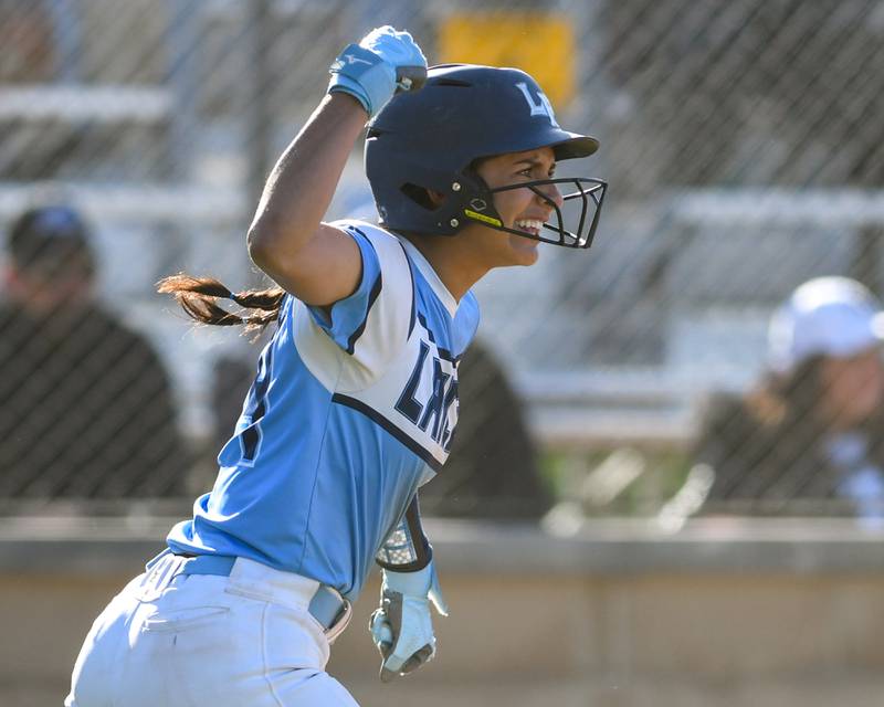 Lake Park's Ariana O'Connell celebrates after scoring a run from the bat of teammate Ava Arenz who ended up on second base during the game on Wednesday April 24, 2024, while taking on St. Charles North.