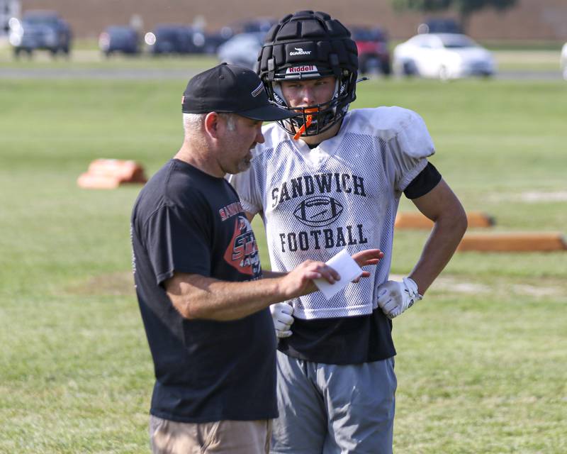 Nick Michalek receives instructions from head coach Jason VanPelt during Sandwich football practice Tuesday, July 22, 2025 in Sandwich.