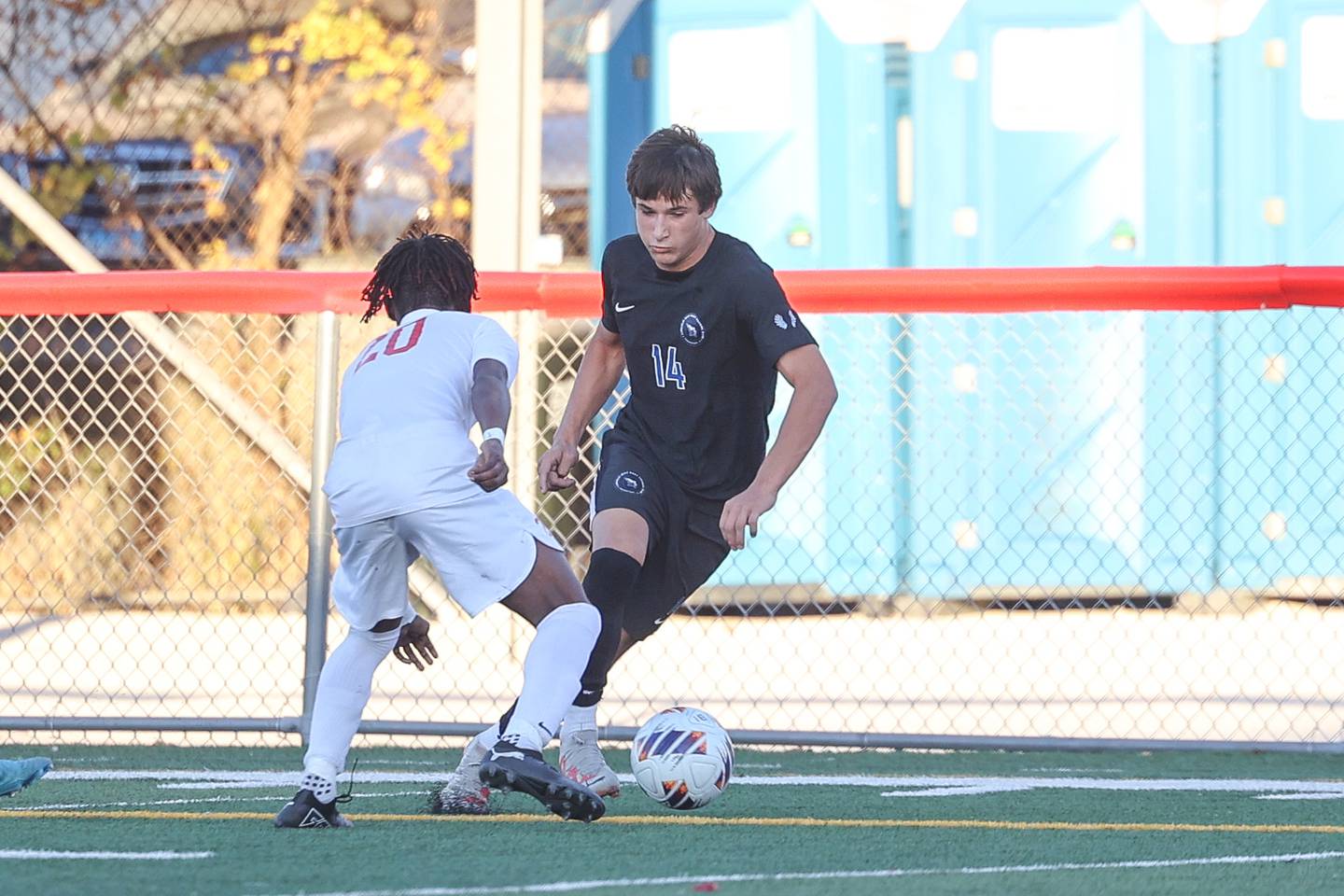 Lincoln-Way East’s Owen Bohren works the ball against Homewood-Flossmoor in the Class 3A Marist Regional semifinal on Wednesday, Oct. 23, 2024 in Chicago.