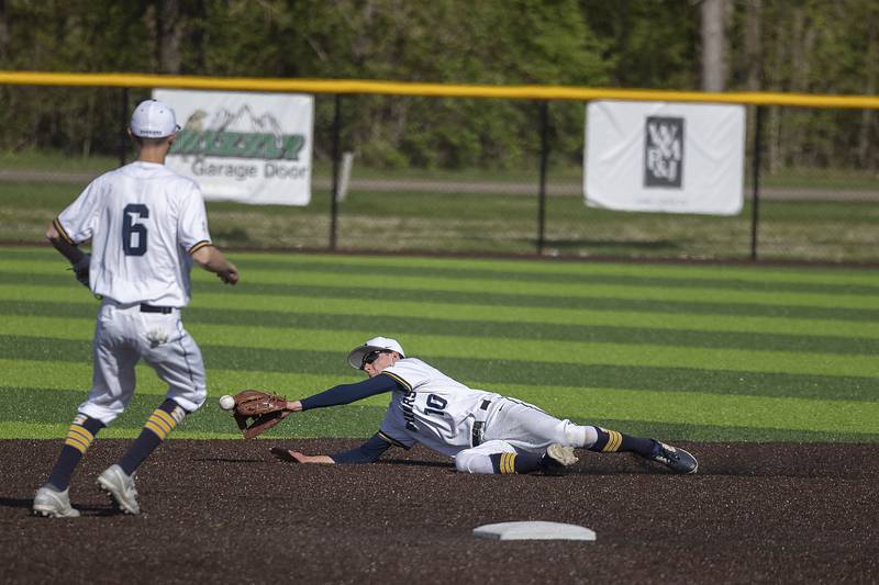 Sterling’s Trevor Dir dives but can’t knock down a drive up the middle against Newman Wednesday, May 3, 2023.