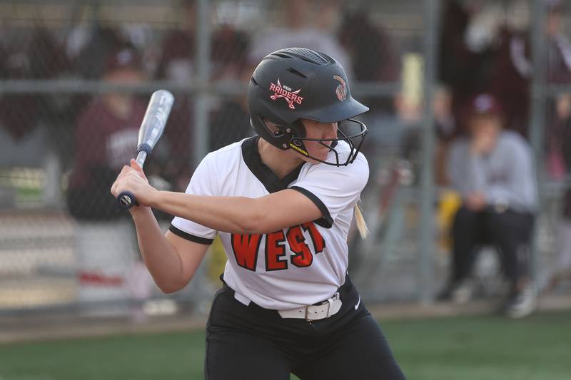 Lincoln-Way West’s Paige Seivert locks in on a pitch for a single against Lockport in the WJOL Softball Tournament championship game on Thursday, April 2, 2026 in Joliet.