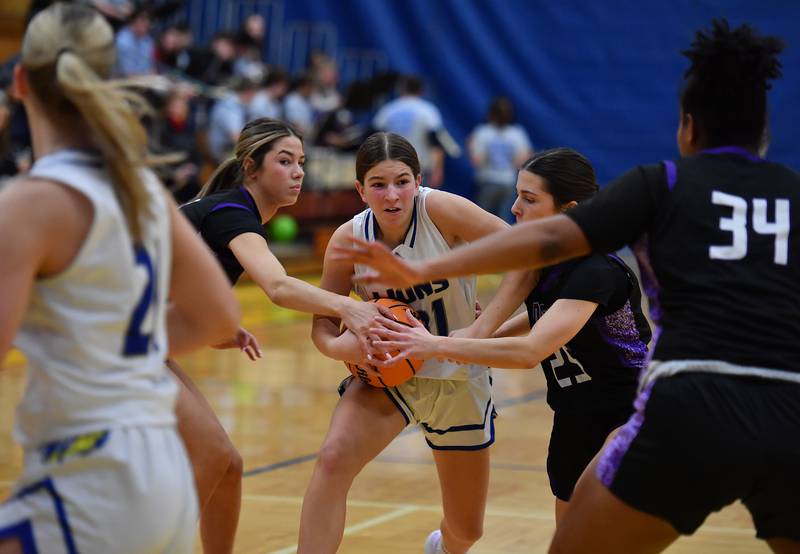 Lyons Township’s Evie Riopell (middle) runs into a crowd of Downers Grove North defenders during a game on January 10, 2026 at Lyons Township High School in LaGrange.