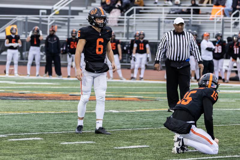 Lincoln-Way West's Zach Hermanson prepares to kick a field goal during a 7A varsity football playoff game against Kenwood at Lincoln-Way West on Nov. 8, 2025.