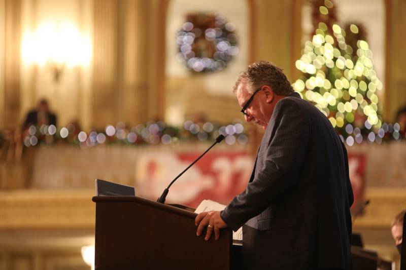 Illinois Farm Bureau Vice President Brian Duncan reviews policy resolutions during the Monday delegate session.