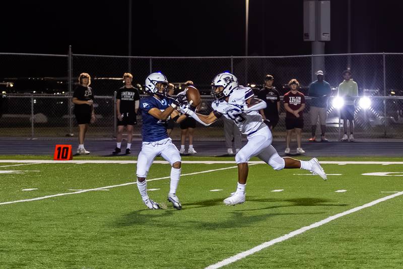 Plainfield South's Brook Williams goes up against Treycen Bownes of Plainfield North on Sept. 13, 2024.