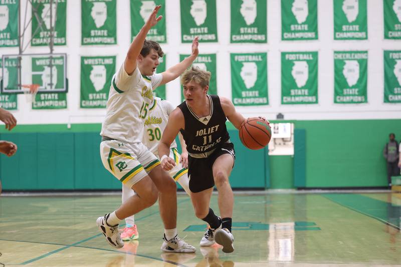 Joliet Catholic’s Drew Wills looks for a play against Providence on Saturday, Dec. 9th, 2023 in New Lenox.