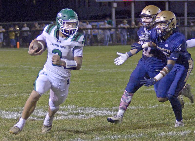 Seneca’s Gunner Varland runs to avoid Marquette’s Grant Dose and Connor Baker in the 2nd quarter Friday at Marquette.