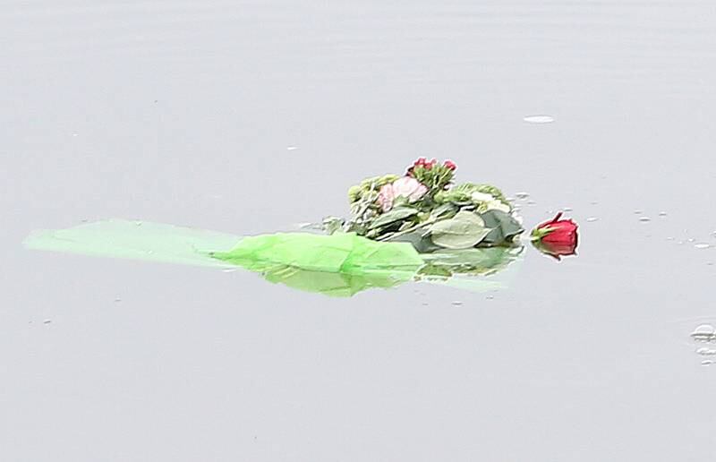 A Wreath and flowers were tossed in the Illinois River during the 44th annual Pearl Harbor parade and memorial ceremony on Saturday, Dec. 2, 2023 in Peru.