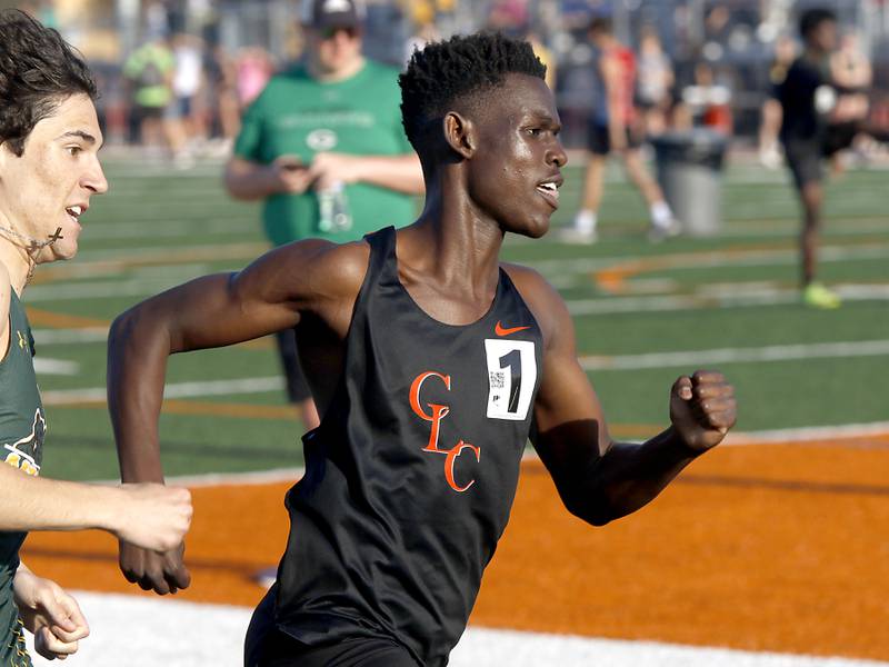Crystal Lake Central’s Amana Omale (right) pulls away from Crystal Lake South’s Joseph Gonzalez to win the 800 meter run on Thursday, April 23, 2026, during the McHenry County Track and Field Meet at McCracken Field in McHenry.