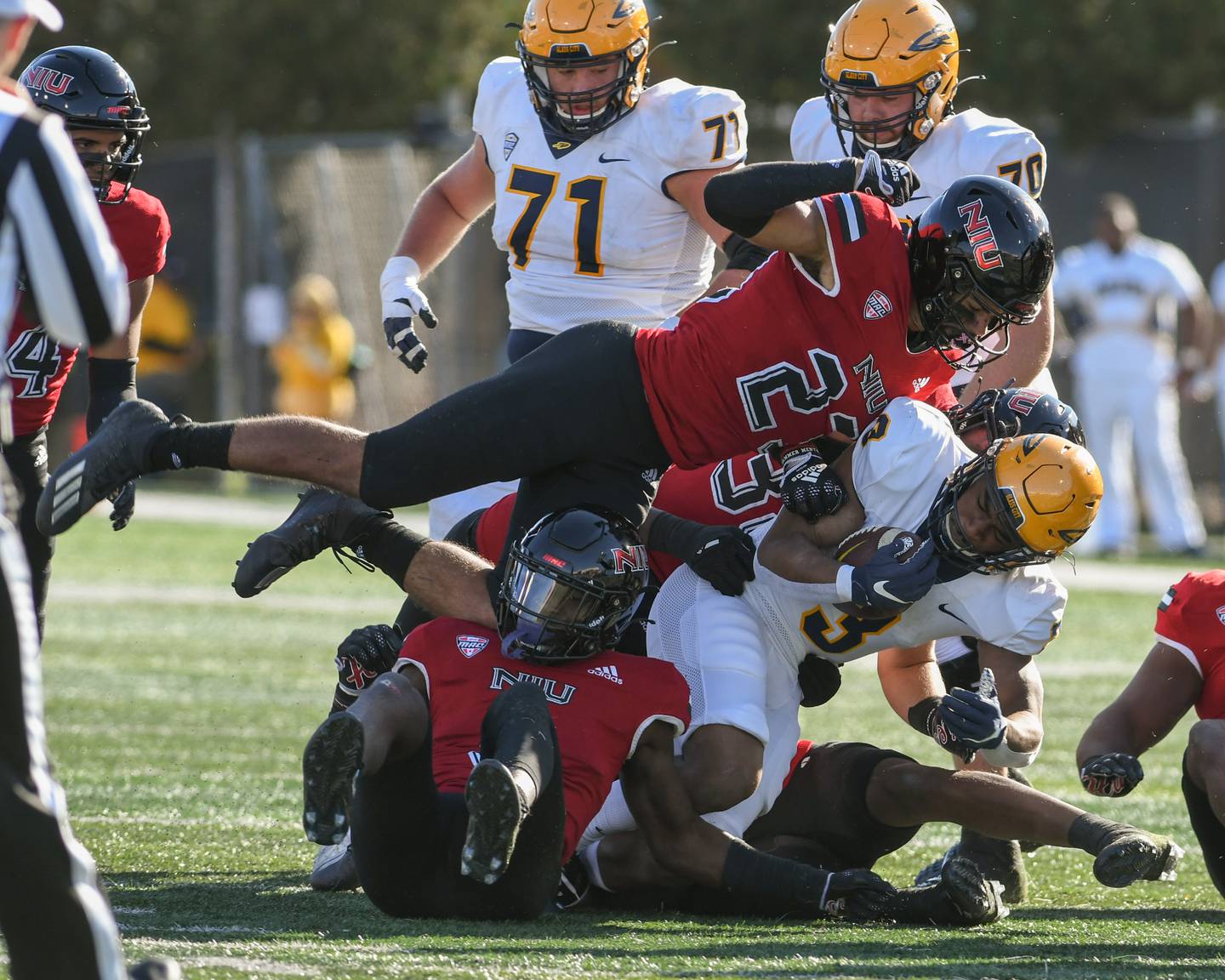 Northern Illinois Jordan White, top, helps bring down a Toledo player in the second quarter on Saturday Nov. 8th