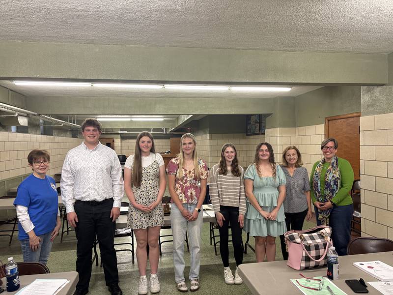 Winners of the 2025 American Legion Americanism Essay Contest stand with members of the Ottawa American Legion post following the awards presentation. The annual contest encourages students to explore patriotic themes through writing.