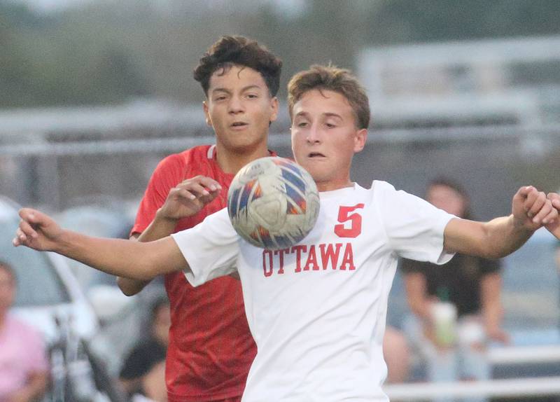 Ottawa's Rory Moore beats out L-P's Adan Pantoja to the ball on Monday, Oct. 6, 2025 at the L-P Athletic Complex in La Salle.