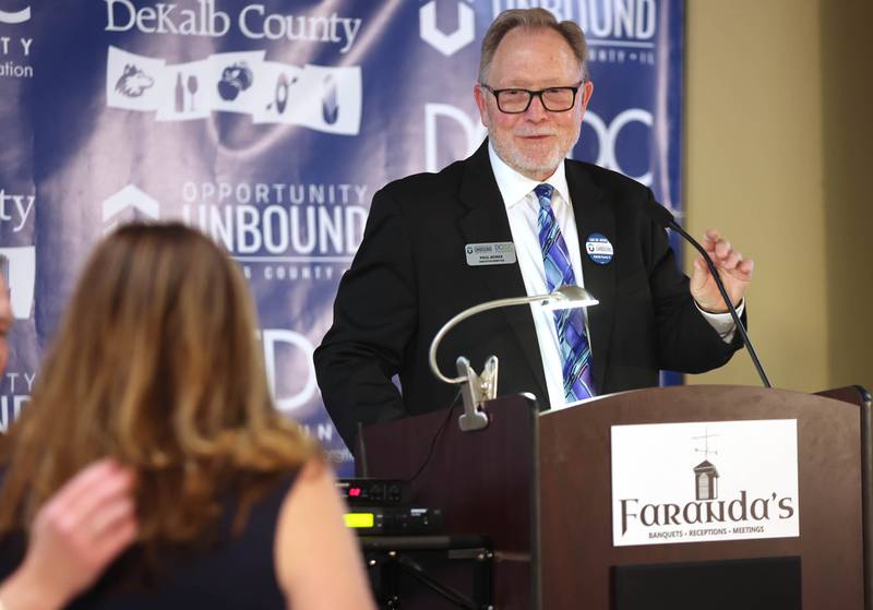 Paul Borek, Executive Director and Enterprise Zone Administrator for the DeKalb County Economic Development Corporation, introduces keynote speaker Nicole Martin, Chief Empowerment Officer and Founder of HRBoost, Thursday, April 28, 2022, during the annual DCEDC dinner and state of the county event at Faranda's Banquet Center in DeKalb.