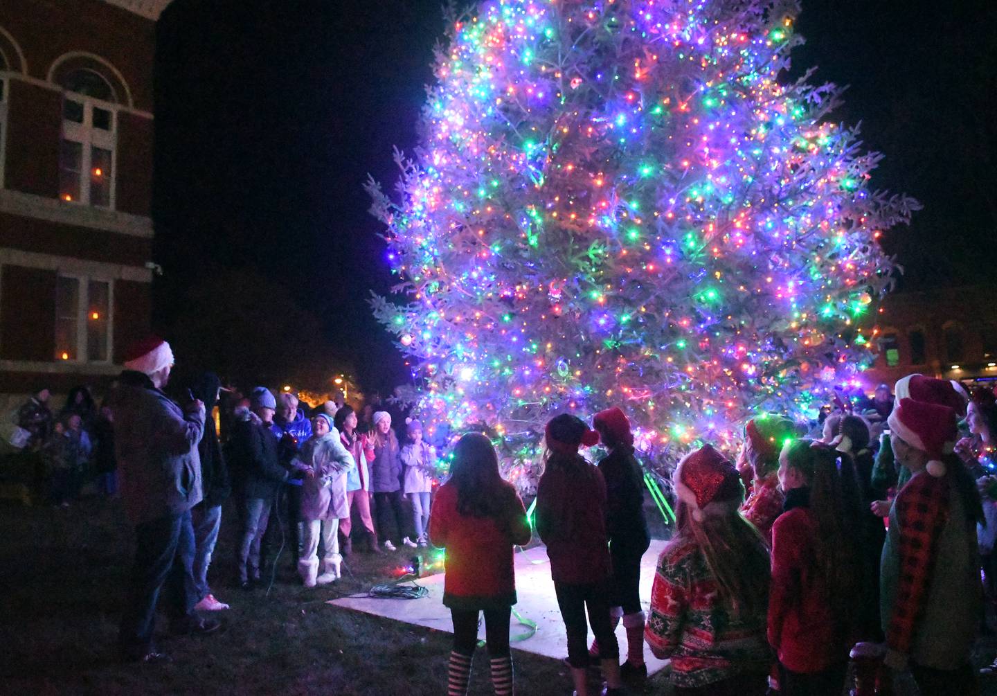 Oregon's Candlelight Walk held Nov. 26 included the lighting of the Christmas tree on the east lawn of the Ogle County Courthouse. This year's tree was lit by three Make-A-Wish recipients.