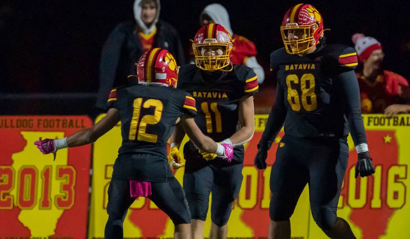 Batavia’s Gerke Drew (11) smiles after scoring a touchdown against Geneva during a football game at Batavia High School on Friday, Oct 7, 2022.