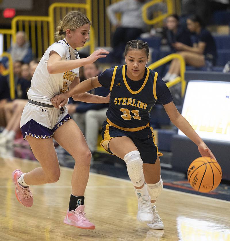 Sterling’s Joslynn James handles the ball against Hononegah’s Ainsley Hughes Saturday, Dec. 21, 2024, during the Sterling Shootout.