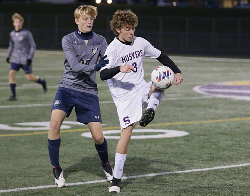 Serena's Hudson Stafford (3) keeps the ball away from Quincy Notre Dame's Cole Schuckman (20) during the Class 1A Sectional semifinal soccer match on Wednesday, Oct. 19, 2022 in Mendota.
