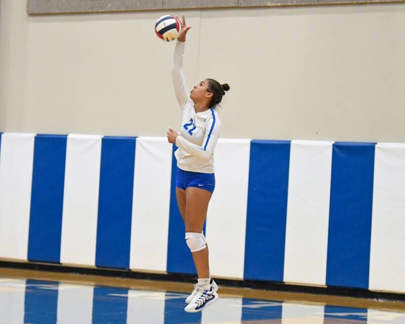 St. Charles North's Sidney Wright (22) serves the ball during the game on Wednesday Oct. 2, 2024, while traveling to take on St. Francis High School in Wheaton.
