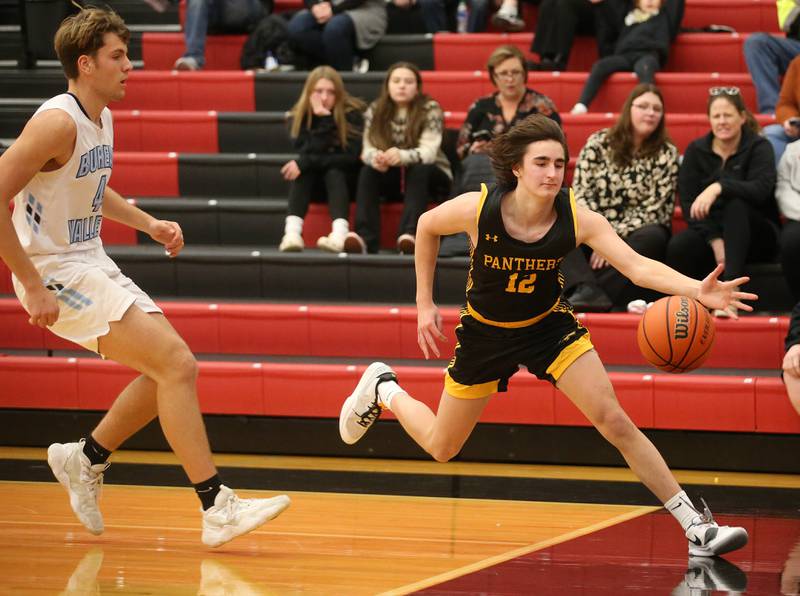 Putnam County's Gavin Cimei attempts to save the ball from going out of bounce against Bureau Valley during the 49th annual Colmone Class on Thursday, Dec. 7, 2023 at Hall High School.