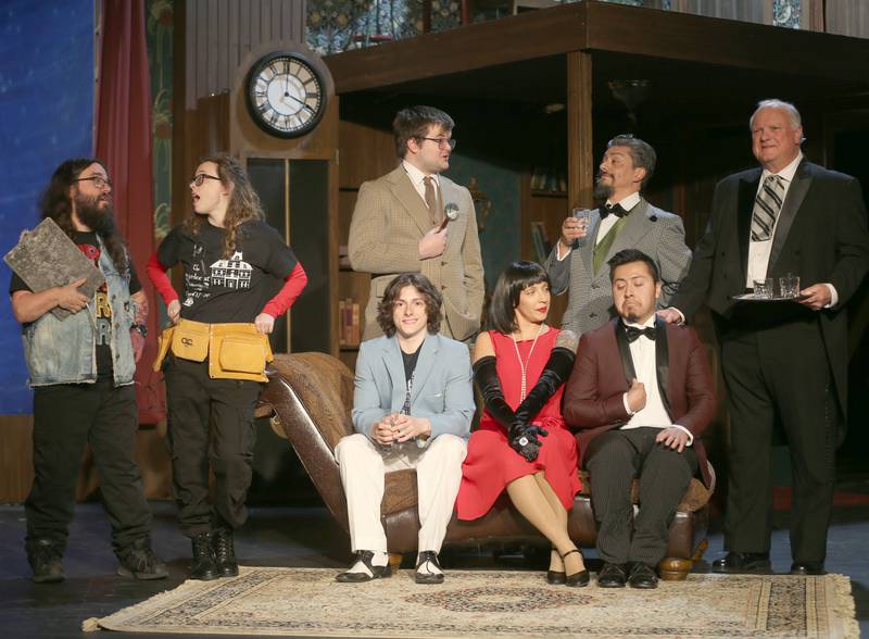 The cast of “The Play That Goes Wrong” (from left) AJ Botero, Anna Klobnak, Robbie Malerk, Alex Guerrero, Scot Harl, (sitting) Nick Adams, Paige Ellerbrock and Charlie Dominguez pose for a photo during rehersal on Tuesday, March 31, 2026 at Stage 212 in La Salle.