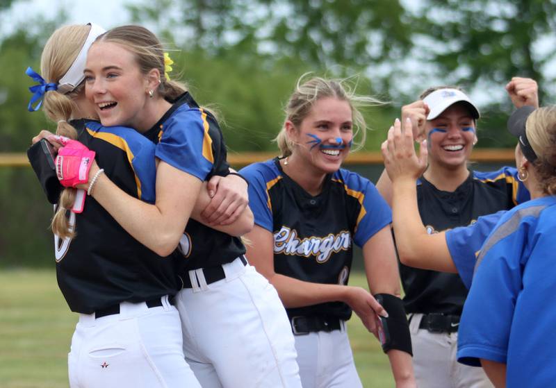 Aurora Central Catholic’s Chargers celebrate a 4-3 win over Marengo in varsity girls softball IHSA Class 2A Regional Title Game action on Friday, May 22, 2026 at Raymond Benoy Field on the campus of Marian Central High School in Woodstock.