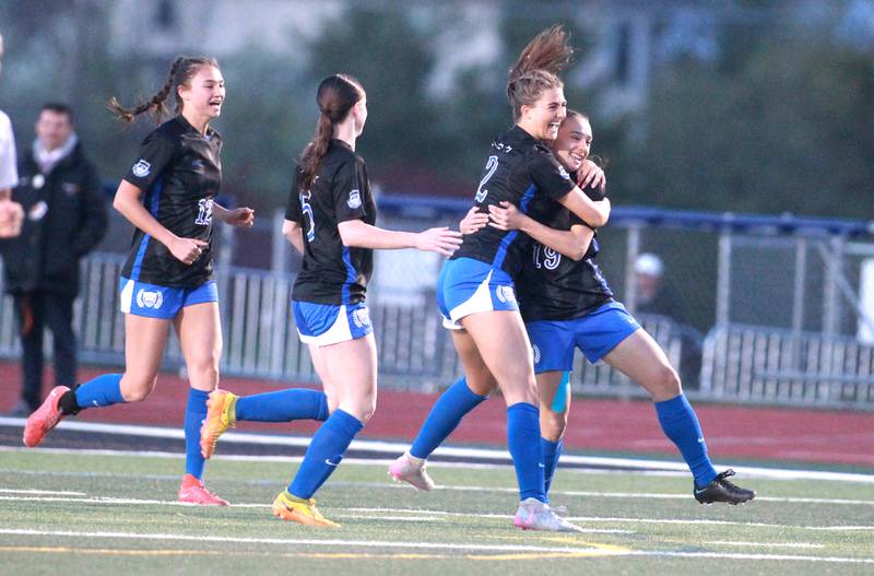 St. Charles North’s Kayla Floyd (left) celebrates with teammate Laney Stark (right) after Stark’s goal during a Tri-Cities Night game against St. Charles East at St. Charles North on Tuesday, April 23, 2024.