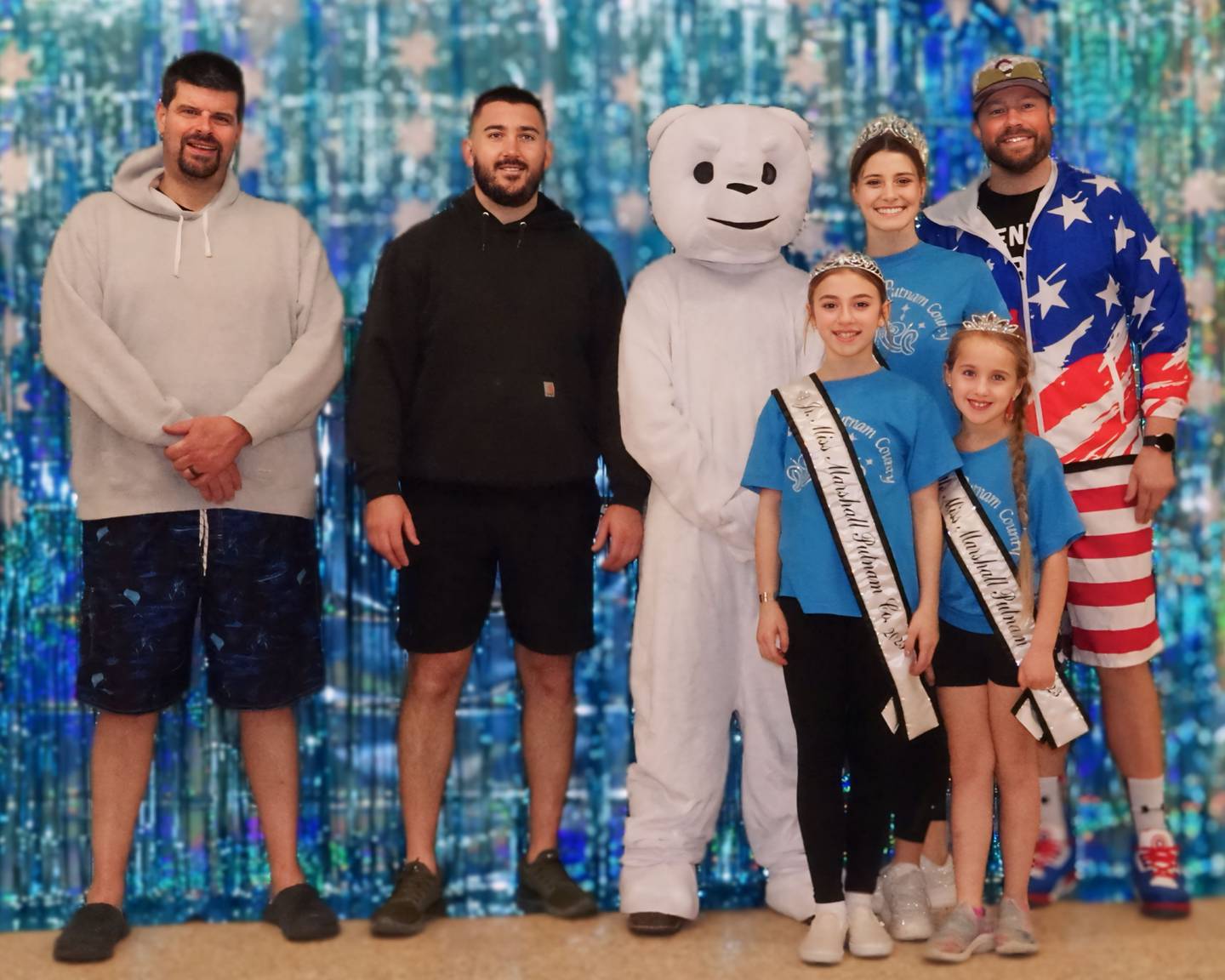 Volunteers of the Polar Plunge along with 2023 Marshall-Putnam County Fair Queen Nadia Kessling and her Court pose for picture on Sunday, March 3, 2024 at Marshall Putnam Fairgrounds.