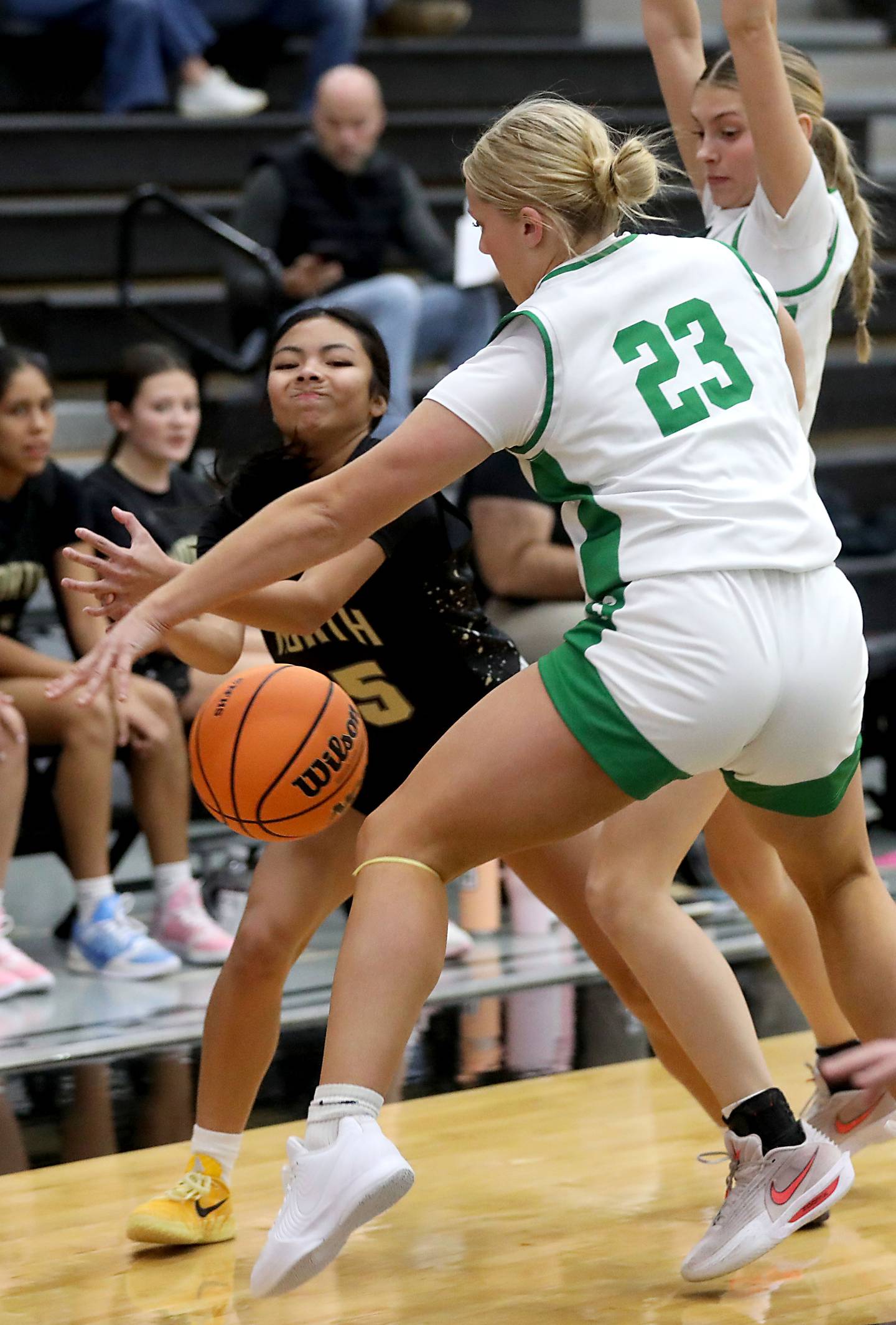 Crystal Lake South's Laken LePage steals the ball from Grayslake North's Mia Leilani Gumapas (left) as Crystal Lake South's Makena Cleary (right) helps defend on the play during a Northern Illinois Holiday Classic semifinal girl basketball game on Tuesday, Dec. 16, 2025, at McHenry High School.