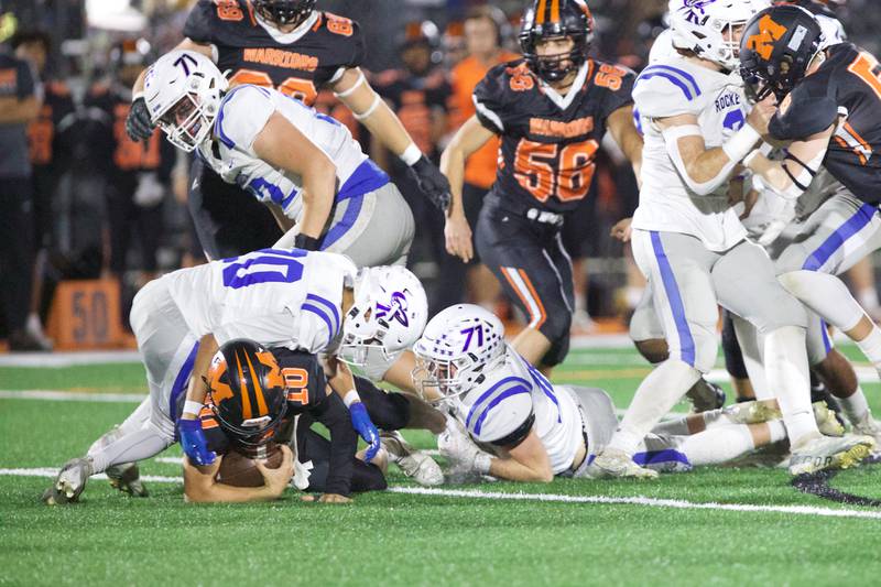 McHenry's Dominick Caruso is tackled by Burlington Central's Rocco Boss on Friday, Oct. 21,2022 in McHenry.