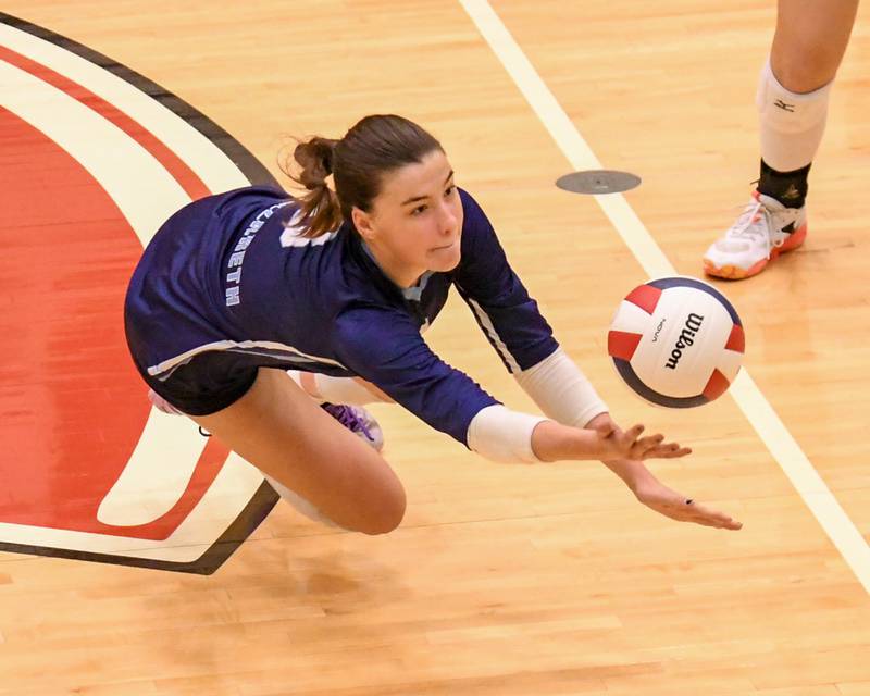 Nazareth Academy's Madeline Briscoe (8) dives for the ball during the sectional title game while taking on Geneva on Thursday Nov. 6, 2025, held at Timothy Christian High School.