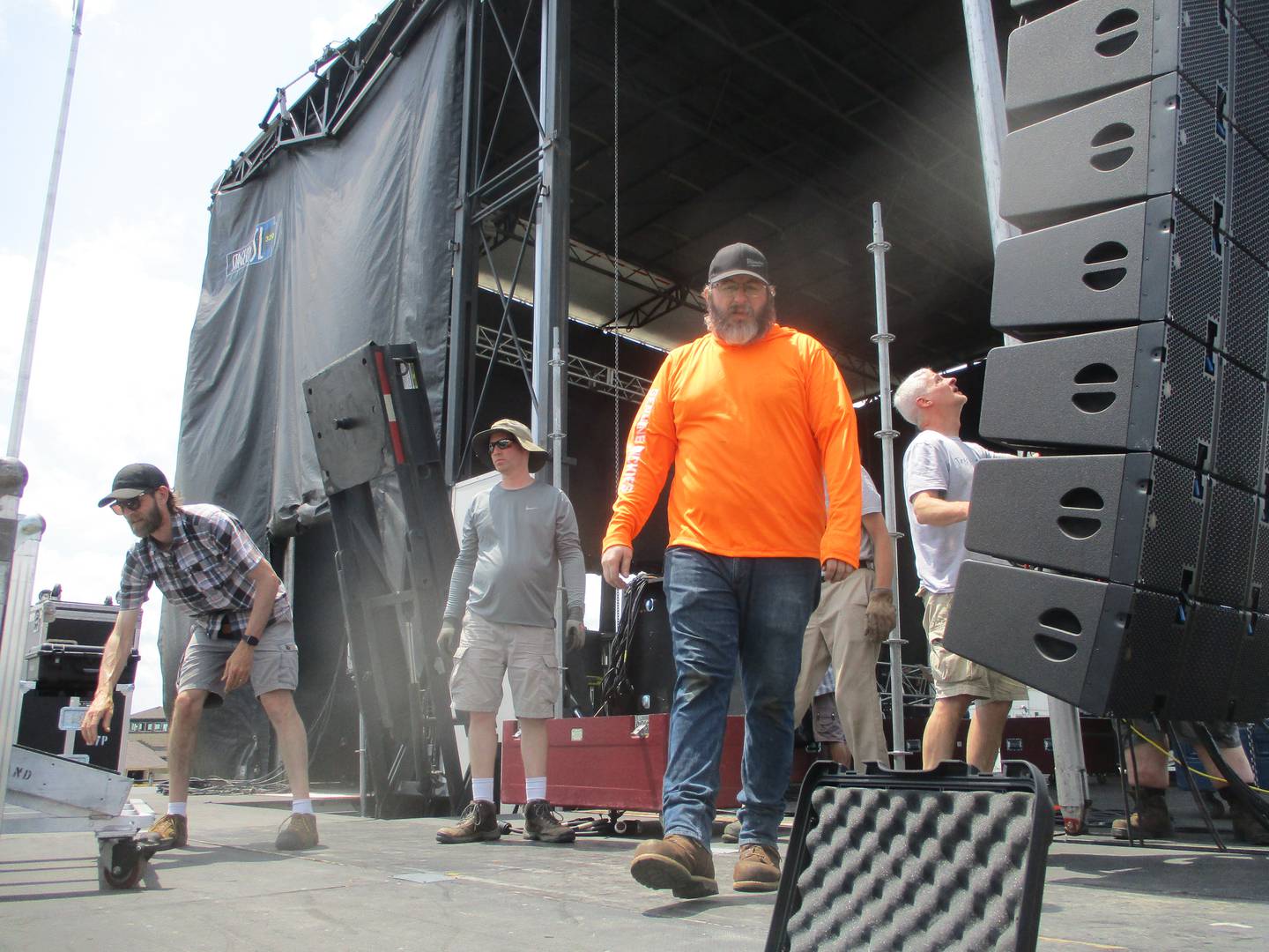 Workers with Joliet Stagehands Local 124 get the main stage ready on Thursday for Taste of Joliet. June 19, 2025